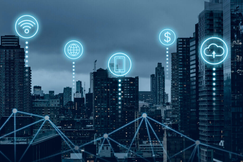 Smart city with digital connectivity icons over skyline.